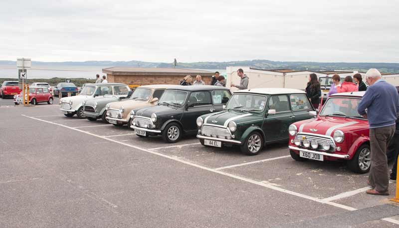 Variety of Minis in car park including a convertible 